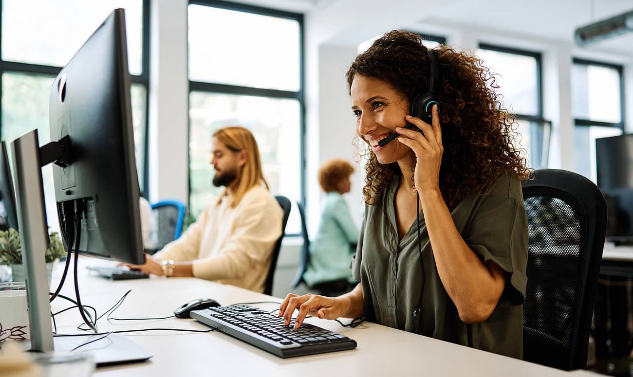 Woman working with computer in a coworking call center